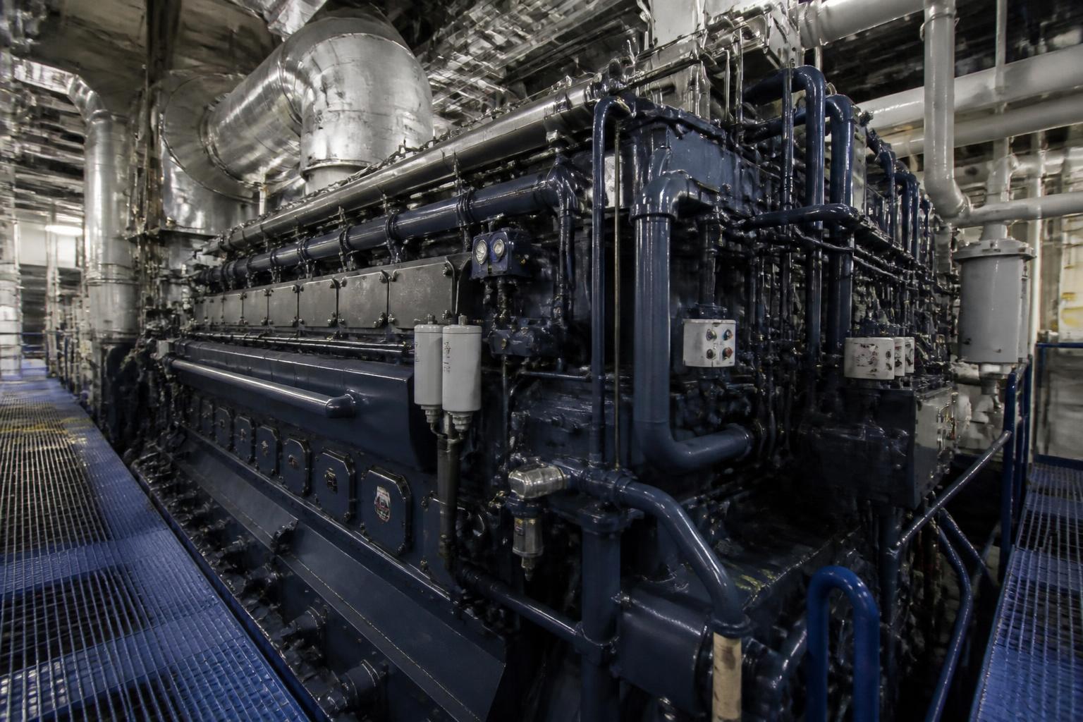 Marine main engine and machinery inside a ship engine room